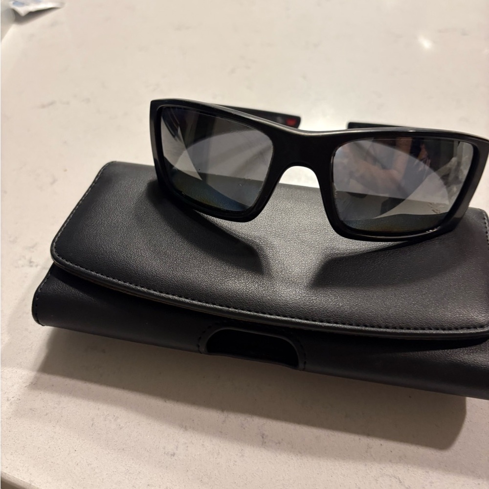 Black Oakley polarized sunglasses